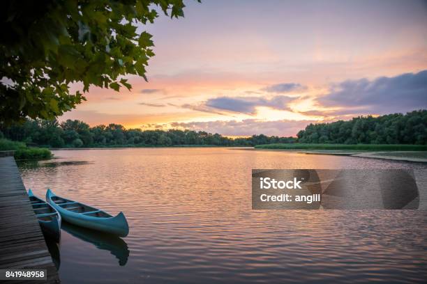 Small Dock And Boat At The Lake Stock Photo - Download Image Now - Lake, River, Sunset