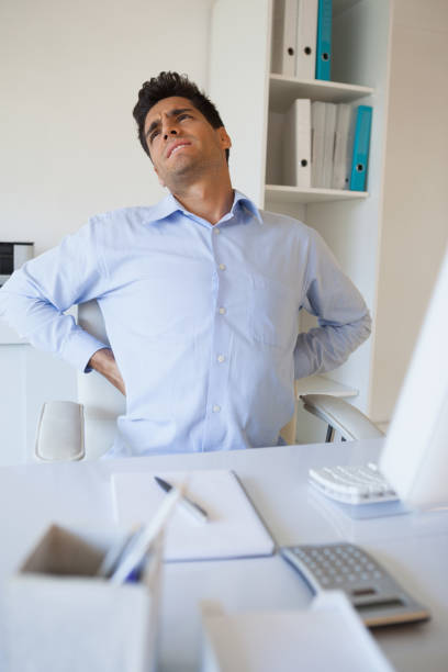 istock Casual businessman stretching his sore back 841954672