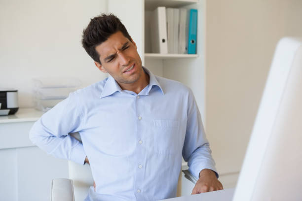 istock Casual businessman touching his sore back 841954686