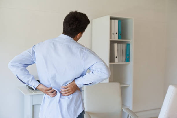 istock Casual businessman touching his sore back 841954710