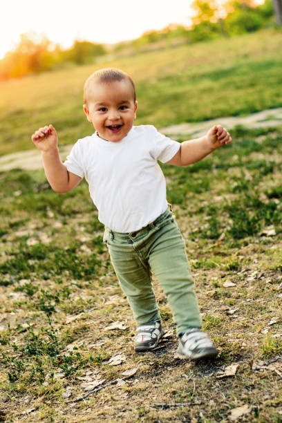 istock Happy baby boy walking in nature 841961416