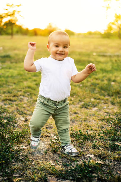 istock Happy baby boy walking in nature 841961532