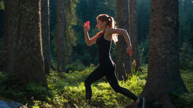 Sportswoman running in nature