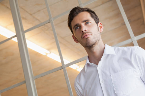 istock Casual businessman standing with serious expression 841971590