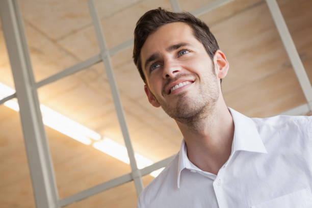 istock Casual businessman standing with happy expression 841971596