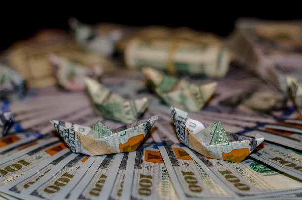 istock more boat dollar banknote on More dollar background 841972248