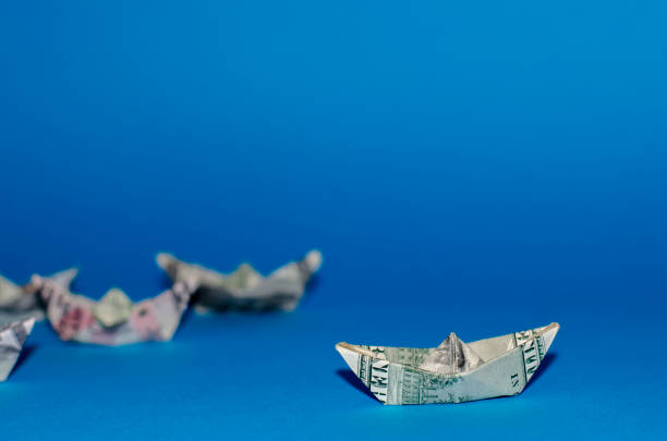 istock more boat dollar banknote on More dollar background 841972310