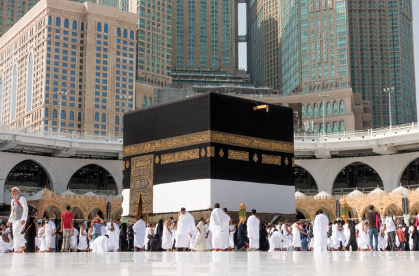 Kaaba in Mecca in Saudi Arabia Mecca, Saudi Arabia - September 10, 2016: Muslim pilgrims put on their white ihrams circling around the holy Kaaba at daytime during Hajj in Saudi Arabia kaabah stock pictures, royalty-free photos & images