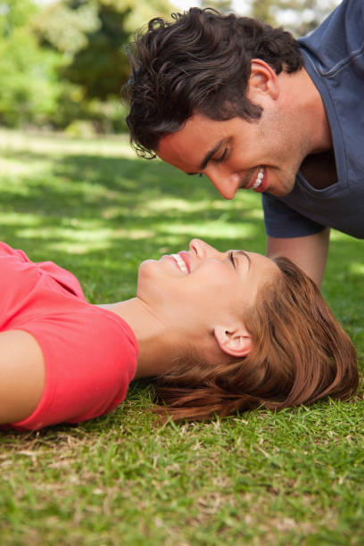 istock Man looking down into his smiling friends eyes 841975016
