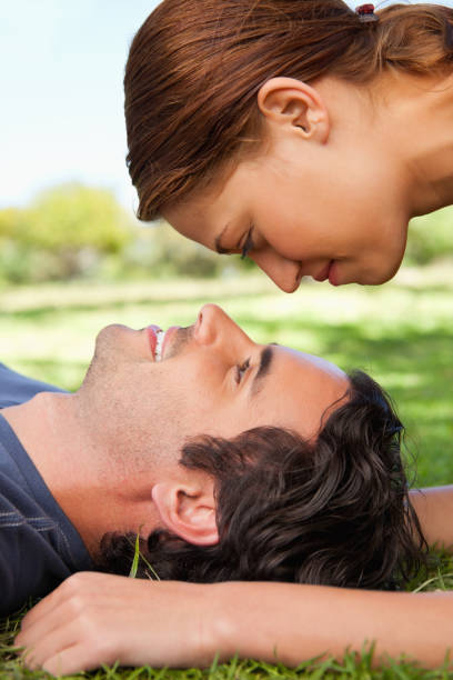 istock Woman looking down towards her smiling friend 841975024