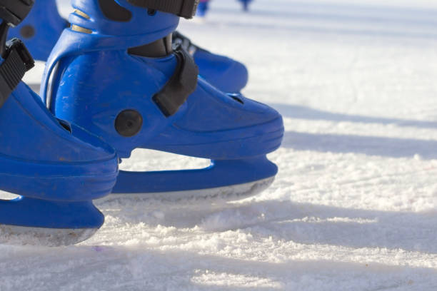 istock Blue skates on the ice rink. Close up 841981306