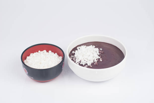 Acai cream with tapioca flour in bowl on white background in perspective