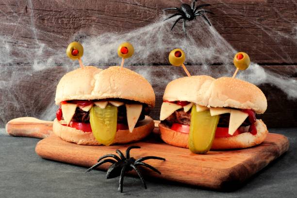 Halloween monster hamburgers with spider web background
