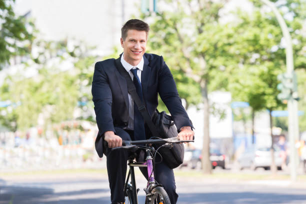istock Male Businessman Riding Bicycle 841998586