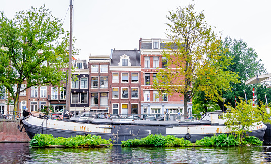 View on House boat in canal of Amsterdam