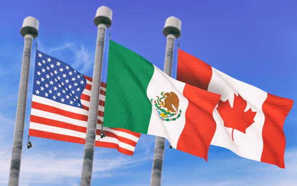 Canada, Mexico and US Flags over blue sky, conceptual image for Nafta agreement (3D rendered image) Canada, Mexico and US Flags over blue sky, conceptual image for Nafta agreement (3D rendered image) canada flag blue sky clouds stock pictures, royalty-free photos & images