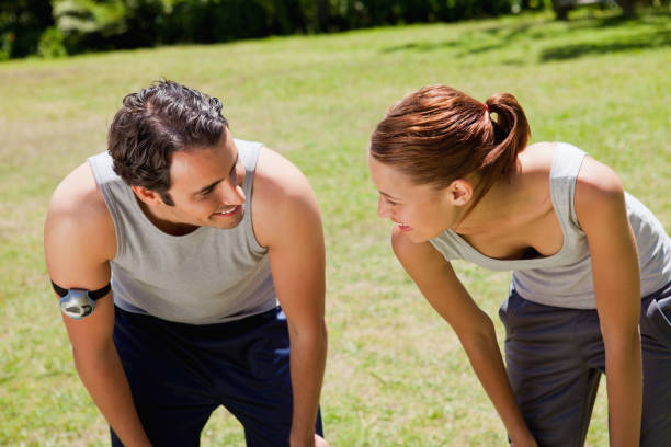 istock Man and a woman bending over while looking at each other 842005554
