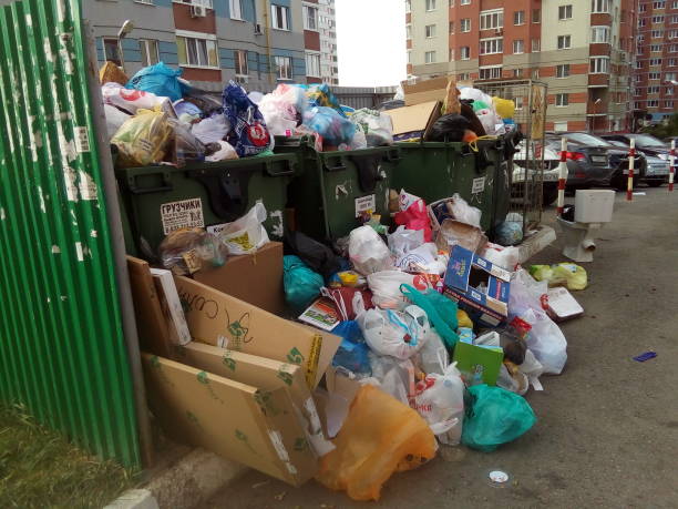 istock Mountains of garbage. Garbage pours out of the garbage cans. 842011796