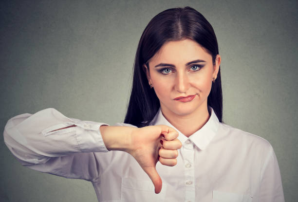 istock Angry woman giving thumbs down gesture 842012008