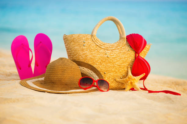 istock Summer beach with accessories. Blur azure sea on background 842015340