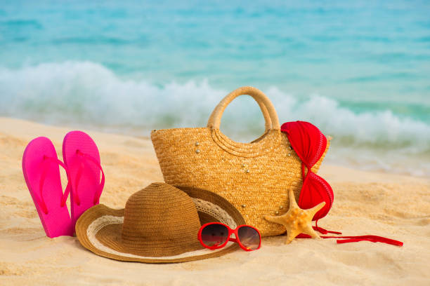 istock Summer beach with accessories. Blur azure sea on background 842015426