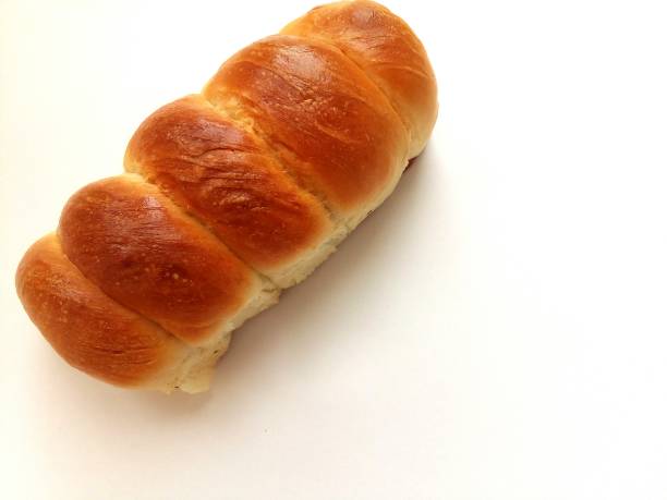 istock sausage in the dough. bun with sausage inside on a white background. 842015752