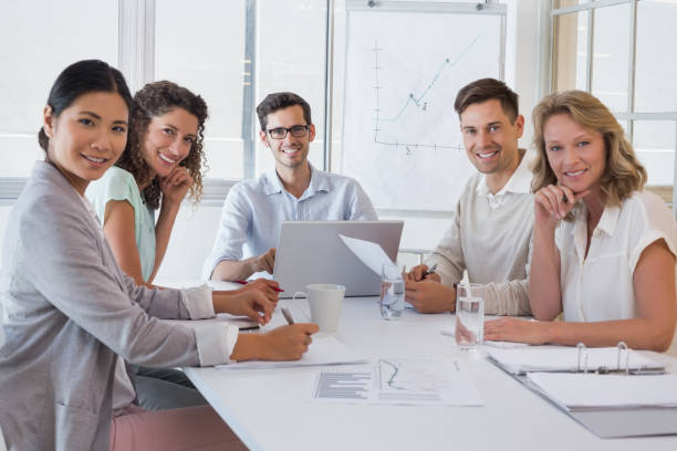 istock Casual business team having a meeting smiling at camera 842016266