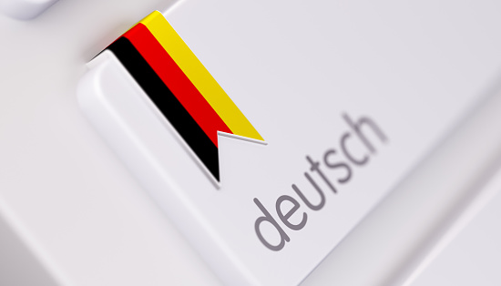Modern Keyboard with German Language Option in German: Online Dictionary Concept