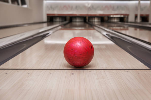 istock red bowling ball on the track in the bowling center 842019294