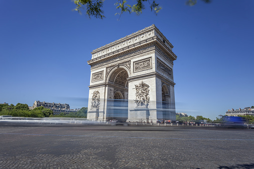 The Triumphal Arch in Paris. Taken on a busy afternoon with blurred motion Traffic.