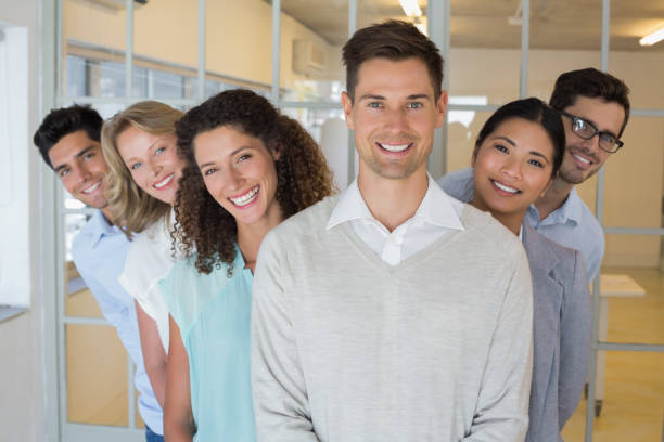 istock Casual business team smiling at camera together 842044468