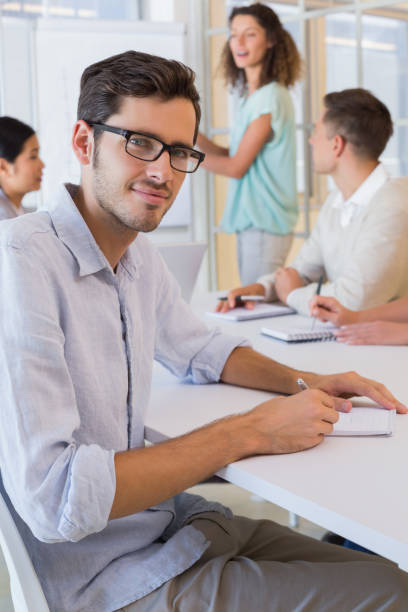istock Casual businessman taking notes during meeting 842046652