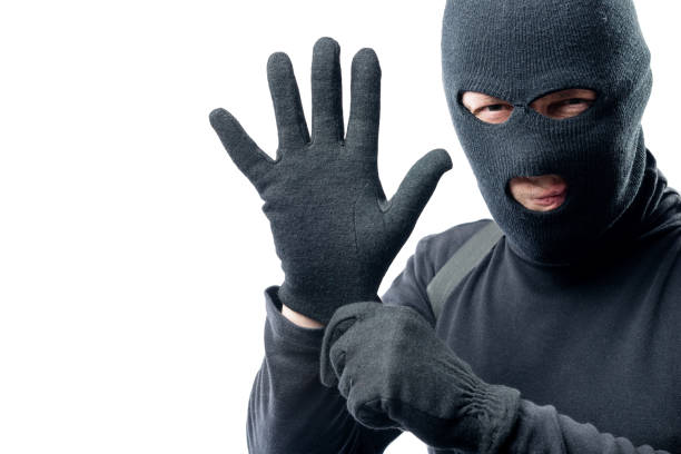 istock The criminal puts on a glove. Preparation for robbery 842054172
