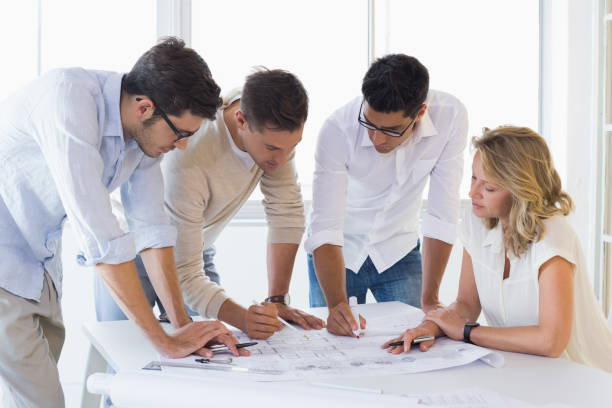 istock Casual architecture team working together at desk 842068584