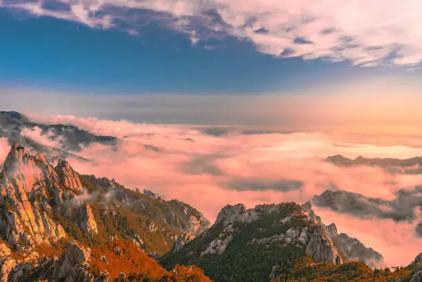 Bukhansan mountains is covered by morning fog and sunrise in Bukhansan National Park in Seoul,Korea.