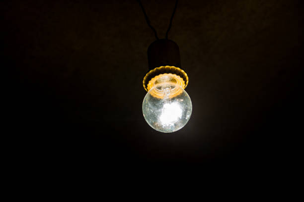 istock Electric light bulb on the dark background 842075834
