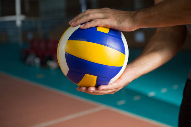 istock Cropped hands of player holding volleyball 842081838