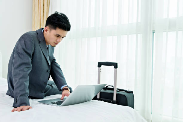 istock Businessman working on a business trip at the hotel 842089934
