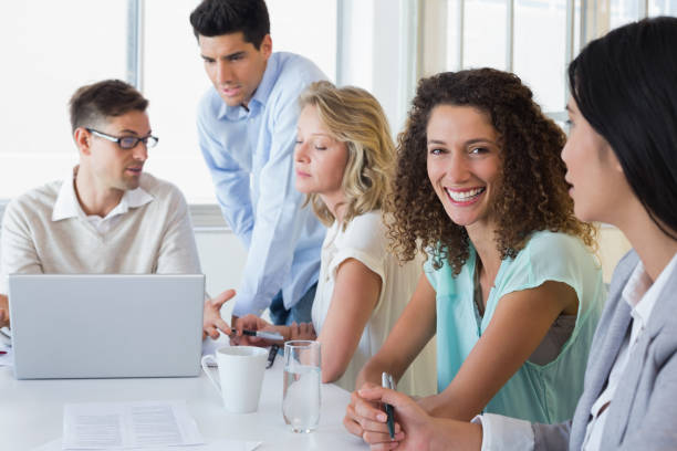 istock Casual business team having a meeting using laptop 842090248