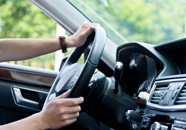 istock Close-up of man hands on the steering wheel 842093412