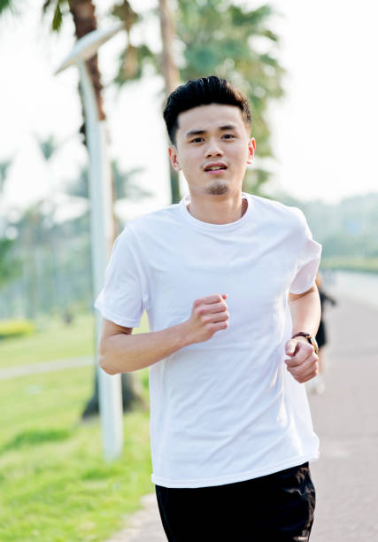 istock Young man jogging outdoors 842093416