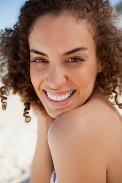 istock Smiling beautiful brunette staring at the camera 842096562
