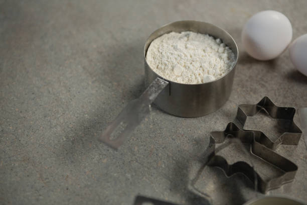 istock High angle view of flour in container with egg and pastry cutters 842097566