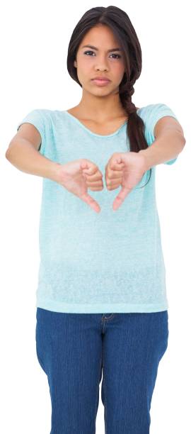 istock Disappointed brunette giving thumbs down 842097938