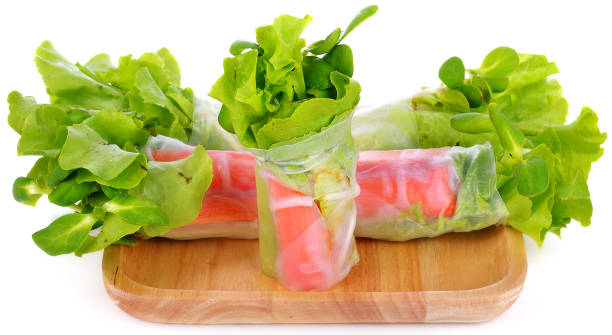 istock Fresh vegetable salad roll in noodle tube on white background 842101062