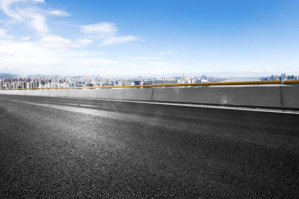 istock empty asphalt road with cityscape of modern city 842103706