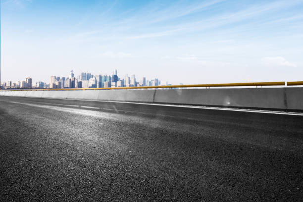 istock empty asphalt road with cityscape of modern city 842104554