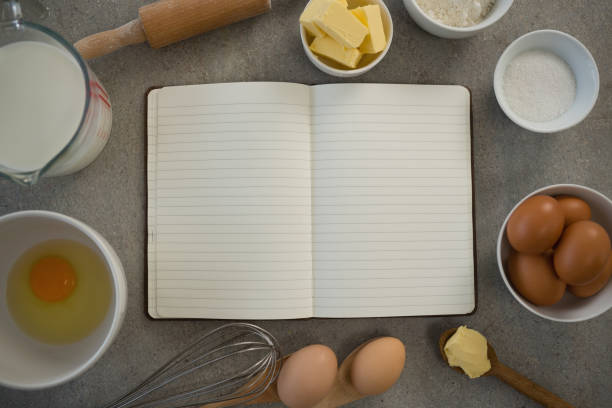 istock Overhead view of ingredients amidst open book 842105012