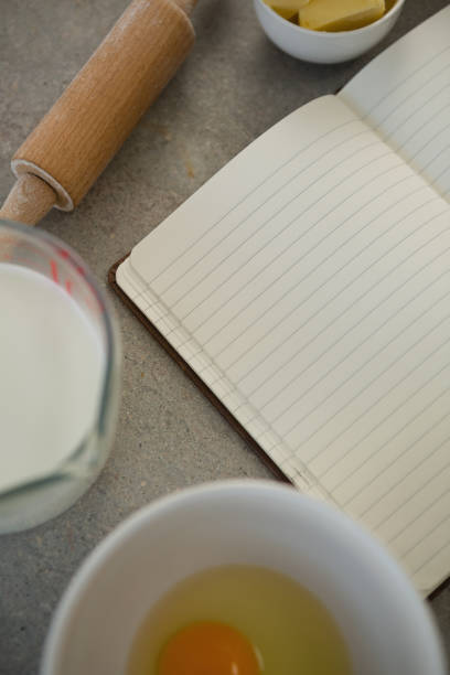 istock Overhead view of ingredients by open book 842105042