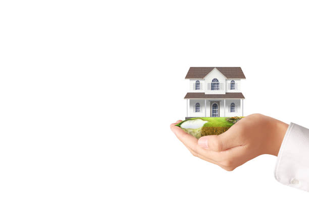 istock Mortgage concept by house from  hand 842107196